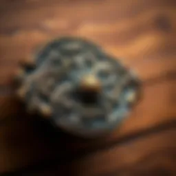 An elegant antique single hole drawer pull showcasing intricate design elements