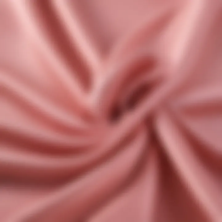 Close-up view of blush spandex fabric showcasing its stretch and texture