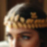 A close-up view of a beautifully crafted gold leaf headband adorned with intricate designs.
