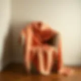 Elegant display of a luxurious cape wrap shawl draped on a minimalist chair