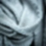 Intricate Texture of Silver Metallic Scarves A close-up of an intricate silver metallic scarf showcasing its shimmering texture.