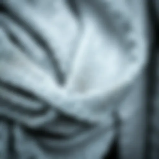 Intricate Texture of Silver Metallic Scarves A close-up of an intricate silver metallic scarf showcasing its shimmering texture.