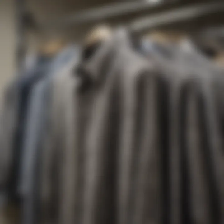 A variety of houndstooth shirts displayed on hangers in a boutique