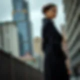 Elegant silhouette of a petite black trench coat styled against an urban backdrop
