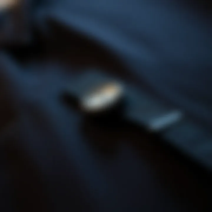 Close-up of the fabric texture of a black trench coat highlighting quality craftsmanship