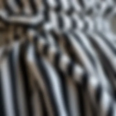 Close-up of fabric textures of a black and white striped dress