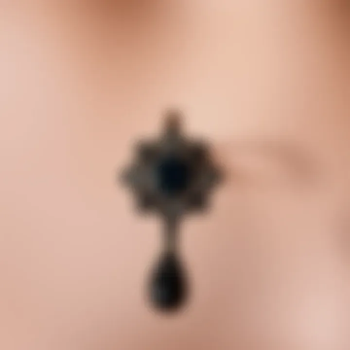 Intricate Design of Goth Belly Button Ring Elegant black goth belly button ring with intricate design.