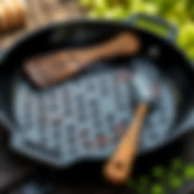 A well-maintained cast iron Korean BBQ pan with utensils and a natural backdrop