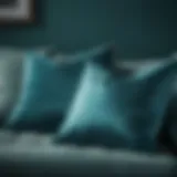 Elegant teal blue throw pillow on a modern sofa